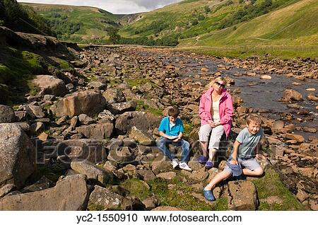 A mother and her two sons at the river Swale at Muker in Swaledale in North Yorkshire, England, Britain, Uk View Large Photo Image Stock Image - A mother and her two sons at the river Swale at Muker in Swaledale in North Yorkshire, England, Britain, Uk. Fotosearch