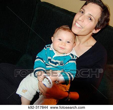 A mother with her 9-month-old son View Large Photo Image Picture - A mother with her 9-month-old son. Fotosearch