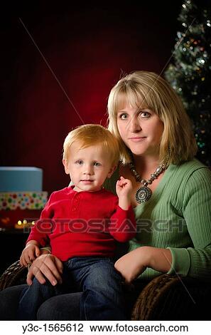A mother with her child at Christmas Time View Large Photo Image Stock Image - A mother with her child at Christmas Time. Fotosearch