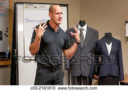 A motivational speaker lectures at a "Men's Career Workshop" on new business attire from Working Wardrobes, a organization helping the unemployed dress and groom for successful business job interviews in Southern California. MODEL RELEASE. View Large Photo Image Stock Image - A motivational speaker lectures at a "Men's Career Workshop" on new business attire from Working Wardrobes, a organization helping the unemployed dress and groom for successful business job interviews in Southern California. MODEL RELEASE.. Fotosearch