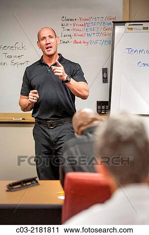 A motivational speaker lectures at a "Men's Career Workshop" on new business attire from Working Wardrobes, a organization helping the unemployed dress and groom for successful business job interviews in Southern California. MODEL RELEASE. View Large Photo Image Stock Image - A motivational speaker lectures at a "Men's Career Workshop" on new business attire from Working Wardrobes, a organization helping the unemployed dress and groom for successful business job interviews in Southern California. MODEL RELEASE.. Fotosearch