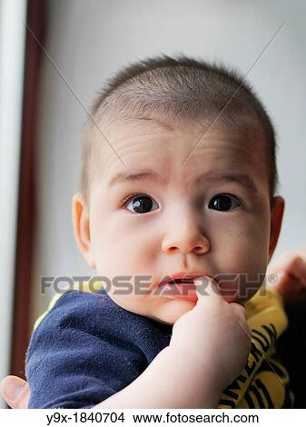 A multi ethnic baby boy making various faces and gestures View Large Photo Image Picture - A multi ethnic baby boy making various faces and gestures. Fotosearch