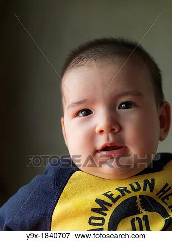 Stock Photo - A multi ethnic baby boy making various faces and gestures. Fotosearch