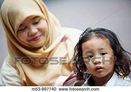 a muslim mother with her young child kuala lumpur malaysia asia View Large Photo Image Stock Image - a muslim mother with her young child kuala lumpur malaysia asia. Fotosearch