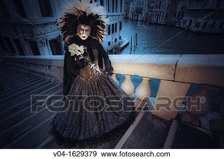 A mystical view of a masked woman on the Rialto Bridge at the carnival in Venice, Italy, Europe View Large Photo Image Stock Photo - A mystical view of a masked woman on the Rialto Bridge at the carnival in Venice, Italy, Europe. Fotosearch
