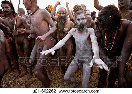 Stock Image - A Nagababa sadhu covered with ashes as he comes out of the sacred Gangesafter the main bath during the Ardh kumbh Mela 2007. Fotosearch