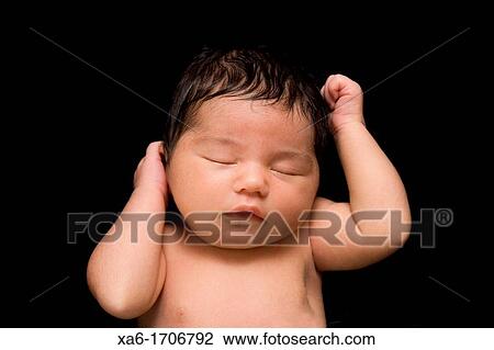 A newborn baby lies sleeping Lots of hair Close up View Large Photo Image Stock Image - A newborn baby lies sleeping Lots of hair Close up. Fotosearch