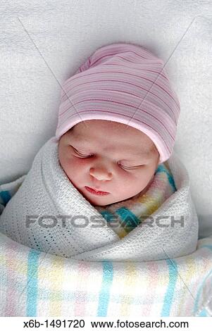 A newborn baby swaddled in blankets View Large Photo Image Stock Image - A newborn baby swaddled in blankets. Fotosearch