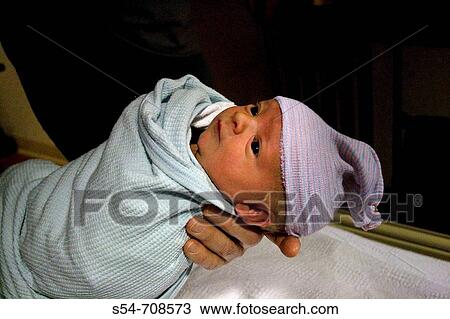 A newborn caucasian baby boy, less than one day old View Large Photo Image Stock Image - A newborn caucasian baby boy, less than one day old. Fotosearch