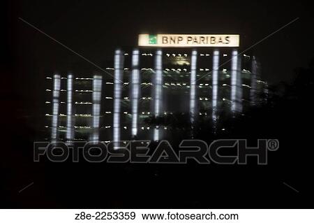 A night shot in the rain, of the corporate office of BNP Paribas at the new commercial hub of Bandra Kurla complex in Mumbai, Maharashtra, India. View Large Photo Image Stock Photo - A night shot in the rain, of the corporate office of BNP Paribas at the new commercial hub of Bandra Kurla complex in Mumbai, Maharashtra, India.. Fotosearch