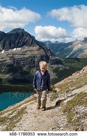 Stock Image - A nine year old boy hikes in the Lake O? Hara area of Yoho National Park, British Columbia, Canada. Fotosearch