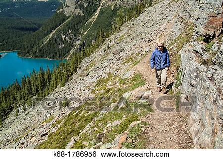 A nine year old boy hikes in the Lake O? Hara area of Yoho National Park, British Columbia, Canada View Large Photo Image Stock Photograph - A nine year old boy hikes in the Lake O? Hara area of Yoho National Park, British Columbia, Canada. Fotosearch
