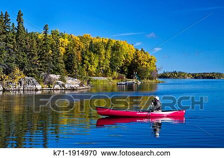 A northern Manitoba landscape of fall foliage color and reflections in a small lake at Baker Narrows near Flin Flon, Manitoba, Canada View Large Photo Image Stock Image - A northern Manitoba landscape of fall foliage color and reflections in a small lake at Baker Narrows near Flin Flon, Manitoba, Canada. Fotosearch