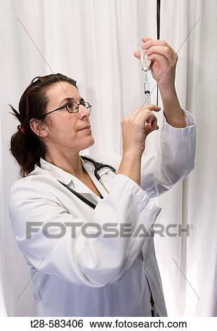 A nurse working View Large Photo Image Stock Photograph - A nurse working. Fotosearch