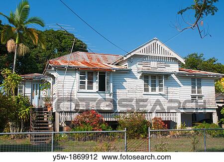 A old-fashioned Queenslander home raised on stilts, in tropical Cairns, North Queensland View Large Photo Image Stock Image - A old-fashioned Queenslander home raised on stilts, in tropical Cairns, North Queensland. Fotosearch
