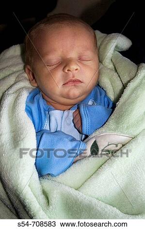 Stock Image - A one-week-old caucasian baby boy asleep. Fotosearch