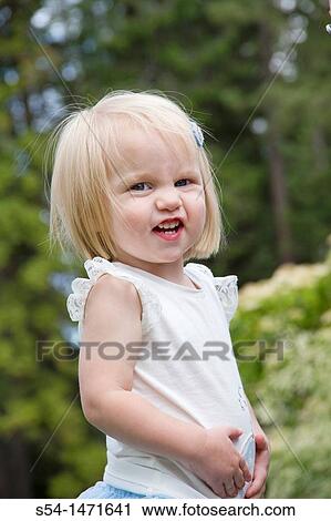 A one-year-old caucasian girl laughing. View Large Photo Image Stock Image - A one-year-old caucasian girl laughing.. Fotosearch