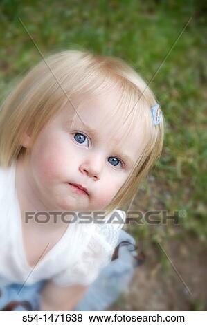 A one-year-old caucasian girl outdoors. View Large Photo Image Stock Photo - A one-year-old caucasian girl outdoors.. Fotosearch