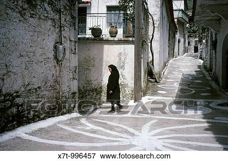 A painted lane in the village of Kastania in the foothills of the Taygetos Mountains Painted lanes are a common site in Mani Villages, Southern Peloponnese, Greece View Large Photo Image Stock Photo - A painted lane in the village of Kastania in the foothills of the Taygetos Mountains Painted lanes are a common site in Mani Villages, Southern Peloponnese, Greece. Fotosearch
