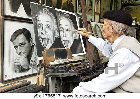 Stock Photo - A painter copying a picture of Albert Einstein. Fotosearch