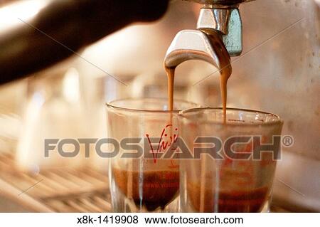 A pair of espresso shots being poured View Large Photo Image Stock Photo - A pair of espresso shots being poured. Fotosearch