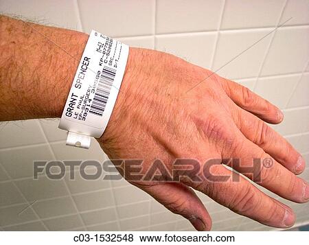 A patient at Kaiser-Permanente, a California Health Maintenance Organization, wears a wrist identification band before a medical procedure Note bar code for precise information View Large Photo Image Stock Photo - A patient at Kaiser-Permanente, a California Health Maintenance Organization, wears a wrist identification band before a medical procedure Note bar code for precise information. Fotosearch