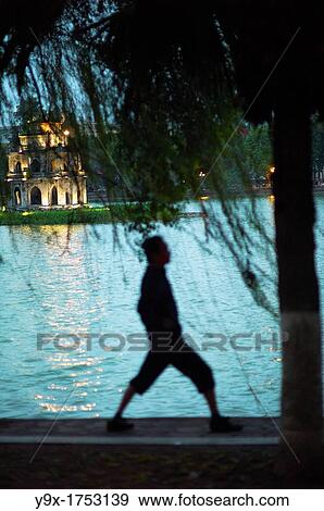 A person doing exercises by the Hoam Kiem Lake in Vietnam View Large Photo Image Stock Photo - A person doing exercises by the Hoam Kiem Lake in Vietnam. Fotosearch