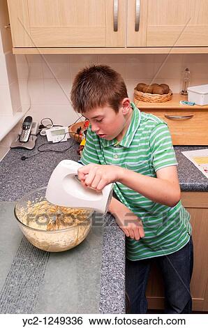 A photo of a ten year old boy mixing cooking ingredients in the Uk View Large Photo Image Stock Photograph - A photo of a ten year old boy mixing cooking ingredients in the Uk. Fotosearch