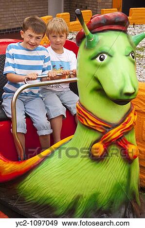 A photo of two boys on the snail ride at the Pleasure Beach in Great Yarmouth, Norfolk, Uk View Large Photo Image Stock Photo - A photo of two boys on the snail ride at the Pleasure Beach in Great Yarmouth, Norfolk, Uk. Fotosearch