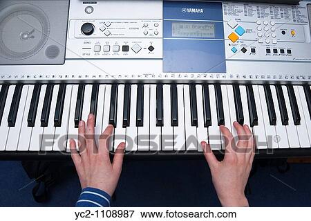 A picture of a 10 year old boy playing his keyboard in the uk View Large Photo Image Stock Photo - A picture of a 10 year old boy playing his keyboard in the uk. Fotosearch