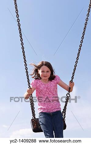 A picture of a nine year old girl outdoors on a swing in the Uk View Large Photo Image Stock Photo - A picture of a nine year old girl outdoors on a swing in the Uk. Fotosearch
