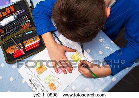 A picture of a ten year old boy doing his maths homework in the Uk View Large Photo Image Stock Image - A picture of a ten year old boy doing his maths homework in the Uk. Fotosearch