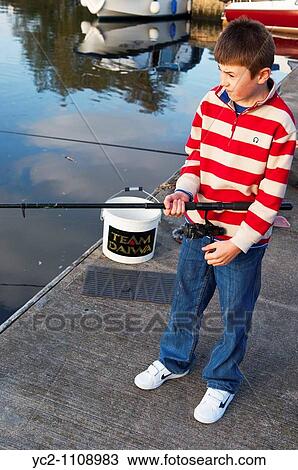 A picture of a ten year old boy fishing in a river in the Uk View Large Photo Image Stock Image - A picture of a ten year old boy fishing in a river in the Uk. Fotosearch