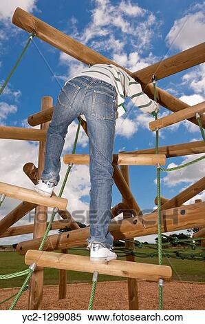 A picture of an eleven year old boy on a climbing frame in the Uk View Large Photo Image Stock Photography - A picture of an eleven year old boy on a climbing frame in the Uk. Fotosearch