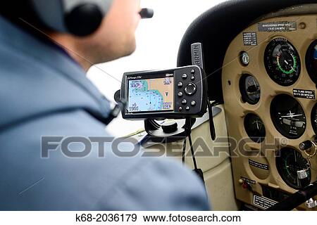 A pilot flies a small plane. View Large Photo Image Stock Photo - A pilot flies a small plane.. Fotosearch