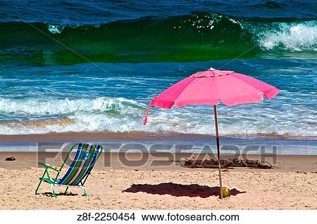 A pink sombrero and a beach chair. Itacare, Bahia, Brazil. View Large Photo Image Picture - A pink sombrero and a beach chair. Itacare, Bahia, Brazil.. Fotosearch