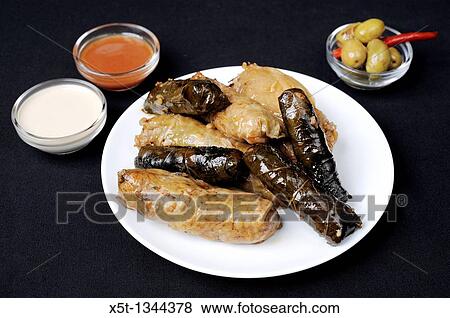 A plate with Stuffed Vine Leaves and Stuffed Cabbage View Large Photo Image Stock Photo - A plate with Stuffed Vine Leaves and Stuffed Cabbage. Fotosearch