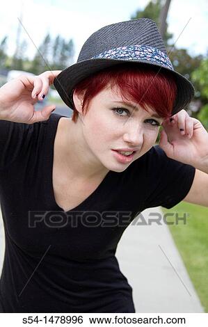 A playful young caucasian woman outdoors View Large Photo Image Stock Photograph - A playful young caucasian woman outdoors. Fotosearch