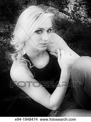 A portrait of 23 year old blond woman in casual clothing in a forest setting. View Large Photo Image Picture - A portrait of 23 year old blond woman in casual clothing in a forest setting.. Fotosearch