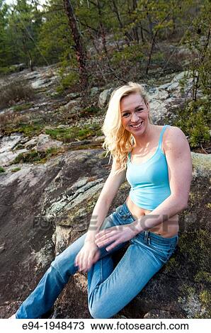 A portrait of 23 year old blond woman in casual clothing in a forest setting. View Large Photo Image Stock Image - A portrait of 23 year old blond woman in casual clothing in a forest setting.. Fotosearch
