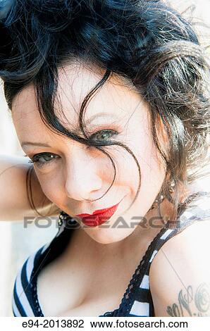 A portrait of a 35 year old brunette woman posing in an urban environment. View Large Photo Image Stock Image - A portrait of a 35 year old brunette woman posing in an urban environment.. Fotosearch