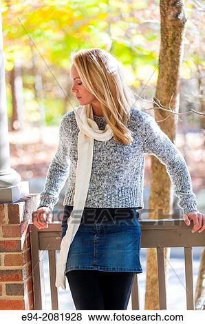 A portrait of a 39 year old blond woman wearing a sweater outdoors. View Large Photo Image Stock Photo - A portrait of a 39 year old blond woman wearing a sweater outdoors.. Fotosearch