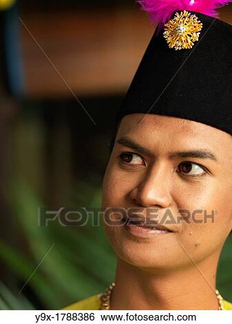 A portrait of a traditionally dressed Malaysian man View Large Photo Image Stock Photograph - A portrait of a traditionally dressed Malaysian man. Fotosearch
