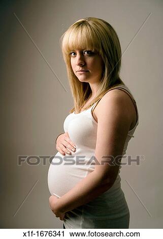 a pregnant young teenage blonde haired girl woman View Large Photo Image Stock Image - a pregnant young teenage blonde haired girl woman. Fotosearch