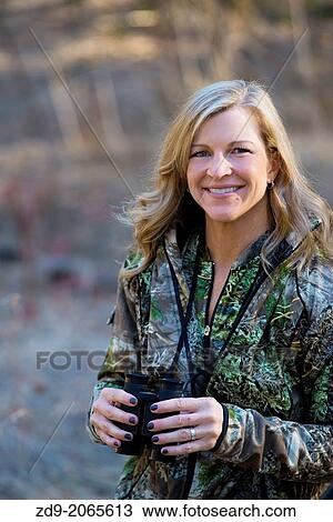 A pretty blonde hunter looks for game. View Large Photo Image Stock Image - A pretty blonde hunter looks for game.. Fotosearch