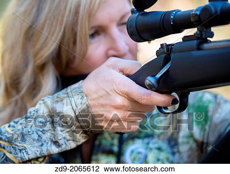A pretty blonde hunter takes aim. View Large Photo Image Stock Image - A pretty blonde hunter takes aim.. Fotosearch