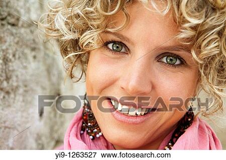 A pretty woman with a cute smiling face View Large Photo Image Stock Photo - A pretty woman with a cute smiling face. Fotosearch