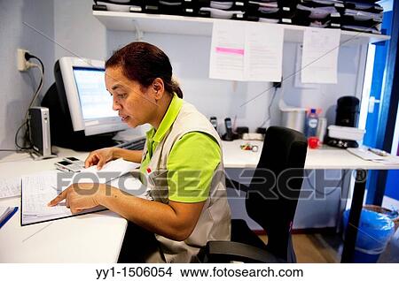A professional nurse of a Rotterdam nursing home documenting her work with elderly inhabitants during the day. View Large Photo Image Picture - A professional nurse of a Rotterdam nursing home documenting her work with elderly inhabitants during the day.. Fotosearch