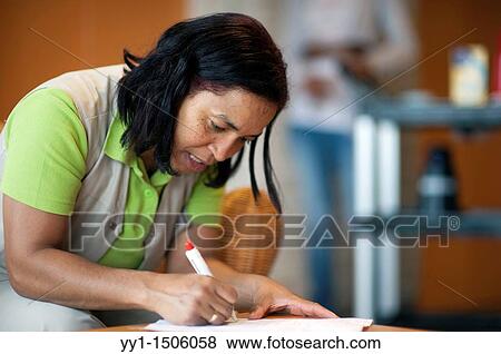 A professional nurse of a Rotterdam nursing home documenting her work with elderly inhabitants during the day. View Large Photo Image Stock Photo - A professional nurse of a Rotterdam nursing home documenting her work with elderly inhabitants during the day.. Fotosearch