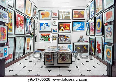 A propaganda poster shop in Vietnam with a man sitting behind a desk View Large Photo Image Stock Photograph - A propaganda poster shop in Vietnam with a man sitting behind a desk. Fotosearch
